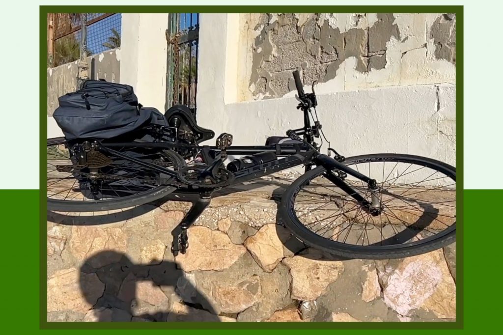 Bike Down Lifting Bike Down to beach while cycling from the Rock of Gibraltar to Malaga